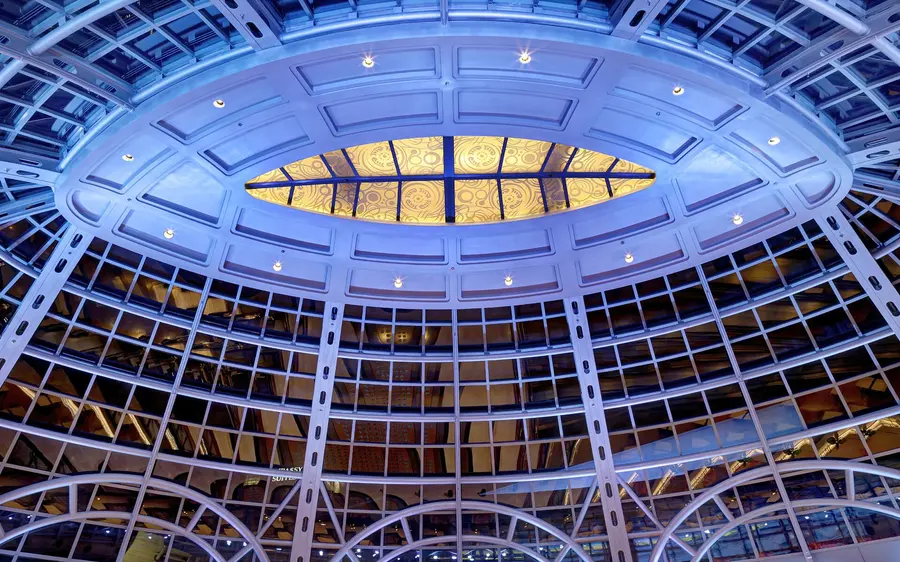 The blue-lit glass rotunda over the rear concourse of Fallsview Casino Resort, seen from below
